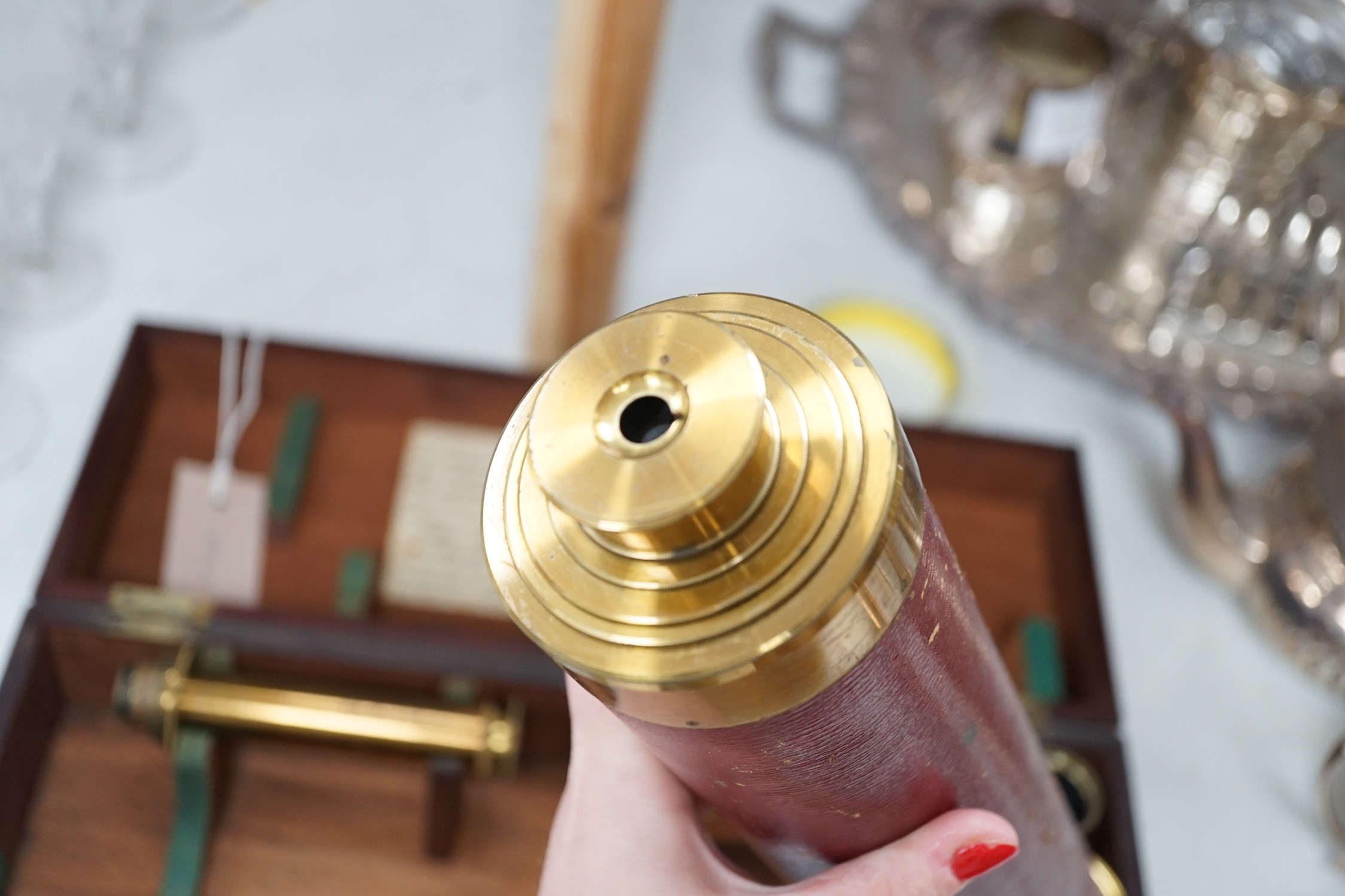 A cased early 19th century brass astronomical telescope, by Dollond, London, with separate screw fitting ‘Pancratic eye tube’ and other optics with sun filters, case 40cm